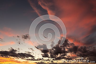 Moody cloudscape, with beautifully colored clouds at dusk Stock Photo