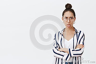 Moody girl showing character, expressing dislike, unwilling go home from party. Good-looking feminine woman in stylish Stock Photo