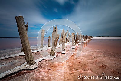 Moody landscape of salt lake, natural pink color of salty water. Long exposure Stock Photo