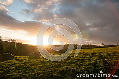 Moody sunset over Devon fields Stock Photo