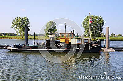 View on old antique wood ship on river maas in dutch countryside Editorial Stock Photo