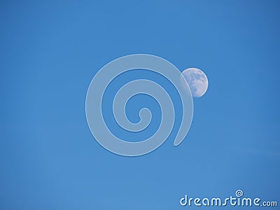 The moon against the blue sky. Natural background. Stock Photo