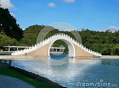 Moon Bridge at Dahu Park lake Stock Photo