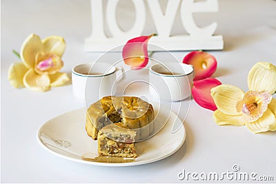 Moon cake, food for Vietnamese mid autumn festival. Focus on moon cake and others are blurred Stock Photo