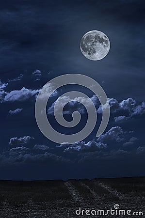 Moon and clouds in the night. Moonlight and road background Stock Photo