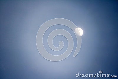 The moon on daylight, it is the natural satellite of the earth. Stock Photo