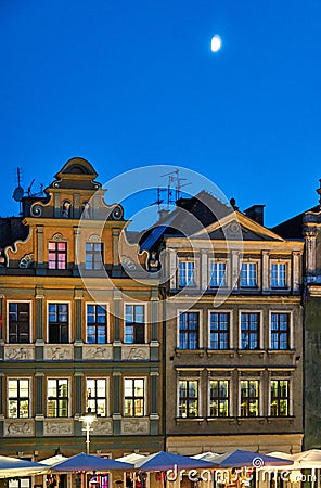 Moon and facade of tenements in the Old Market Square at night Editorial Stock Photo