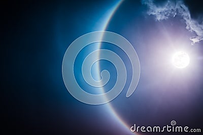 Moon halo phenomenon. Nighttime sky and bright full moon with sh Stock Photo