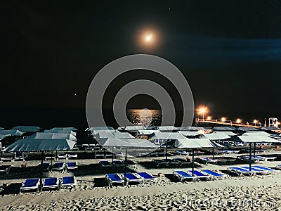 Moon are laying ower the silent beach Stock Photo