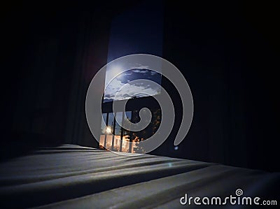 Bed in the moon light, open window, summer garden Stock Photo