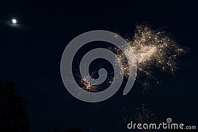 Moon Looks Over Fireworks Stock Photo