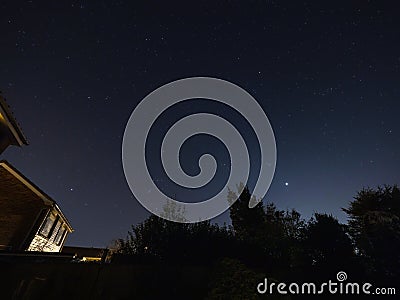 Moon, Orion, Sirius and Venus in Night Sky Stock Photo