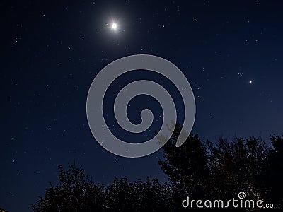 Moon, Orion and Venus in Night Sky Stock Photo