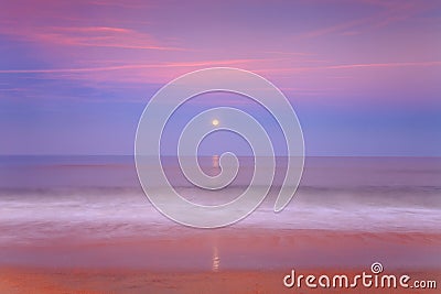 Moonrise over the ocean Stock Photo