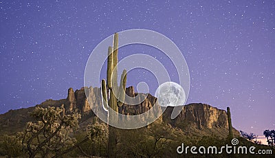 Moon Rises over Superstition Mountains Stock Photo