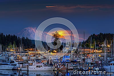 Moon Rising behind Mt.Rainier Lighting Harbor Editorial Stock Photo