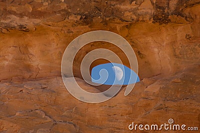 Moon through rock window Stock Photo