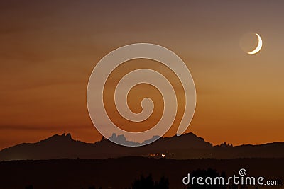 Moon setting over Montserrat Stock Photo