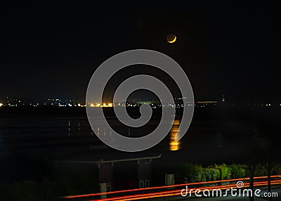 Moon setting over Pegwell Bay in Kent Stock Photo