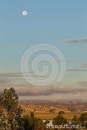 Moon setting over the Portugal and the Guadiana River Stock Photo