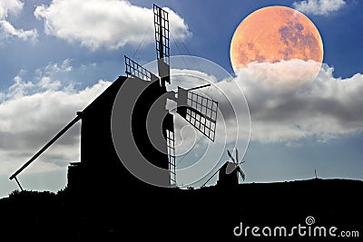 Moon setting over Spanish Windmills Stock Photo