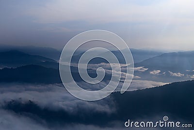 Moon watches Sea of clouds at Sunrise Stock Photo