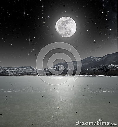 Moonlight on the iced lake Stock Photo