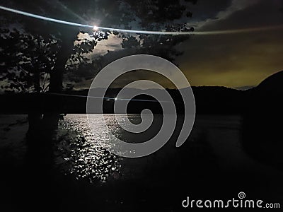 The moonlight over looking the cold river Stock Photo
