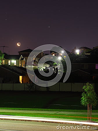 Moon and stars night scene residential area Stock Photo