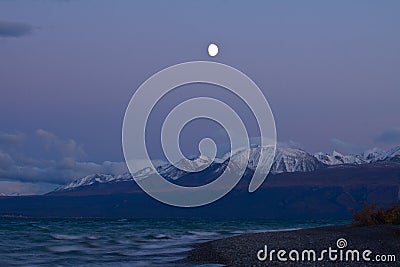 Moonrise over Kluane Lake near Kluane National Park Stock Photo