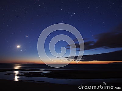 Moon Venus and stars on night sky Stock Photo