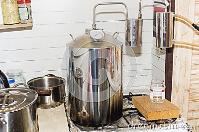 Moonshine still in action, at home Stock Photo