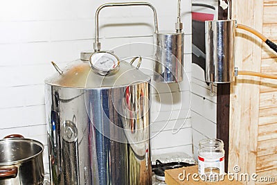Moonshine still in action, at home Stock Photo