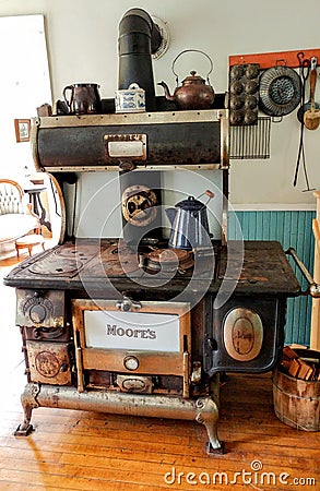 Moore`s Brand Cast Iron Cook Stove in Kitchen Editorial Stock Photo