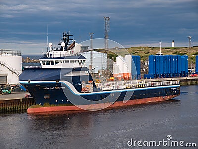 Moored in the Port of Aberdeen, Scotland, the Highland Prestige, an offshore tug / supply ship Editorial Stock Photo