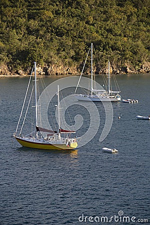 Moored Sailboats Near Cliff Stock Photo