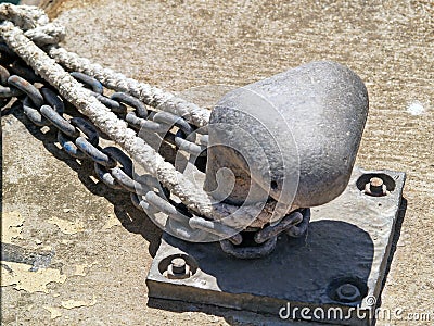 Mooring bollard and naval rope Stock Photo