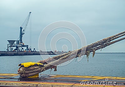Mooring cleat and steel rope or hawser Stock Photo