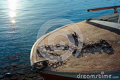 The mooring chain and lock are laid out on the bow of the boat Stock Photo