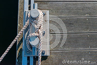 Mooring cleat on a wooden pier Stock Photo