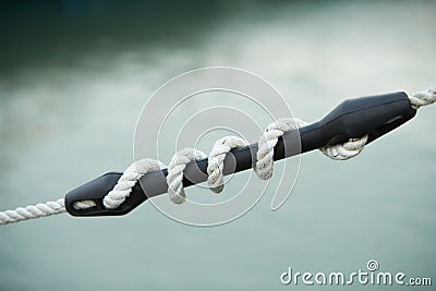 Mooring compensator of rope tension. Detail of boat. Stock Photo