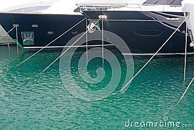 Mooring ropes against Mediterranean gree Stock Photo