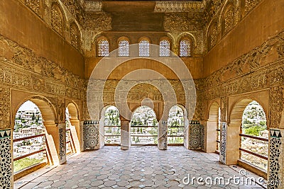 Moorish portico with an Arabic ornaments and amazing view on city is part of El Partal in Alhambra palaces, Granada, Spain Editorial Stock Photo