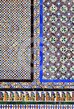 Moorish tiles on a wall in the Alcazar of Seville, Spain Stock Photo