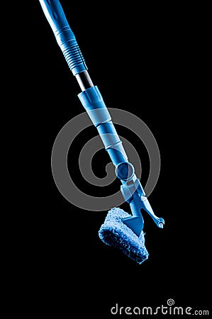 Mop with a rag of blue color for washing glasses and mirrors on a black background, isolate Stock Photo