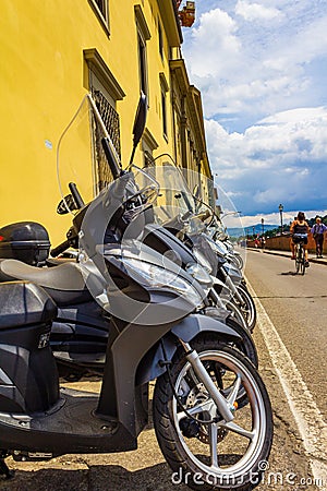 Mopeds parked on a street Florence Italy Editorial Stock Photo