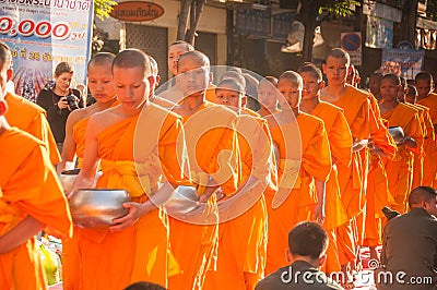 More monks with give alms bowl which came out of the offerings in the morning at Buddhist temple, Culture Heritage Site Editorial Stock Photo