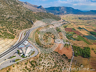 Moreas Motorway at Artemisio mount. A7 begins just west of the Isthmus of Corinth, branching off from Greek National Road 8A Stock Photo