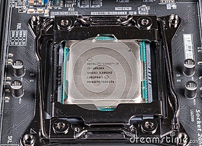 Macro image of Intel Core i9 CPU chip installed on modern motherboard Editorial Stock Photo