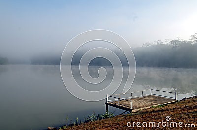 Morning atmosphere at the lake There is a boat embarkation that extends into the reservoir. Stock Photo